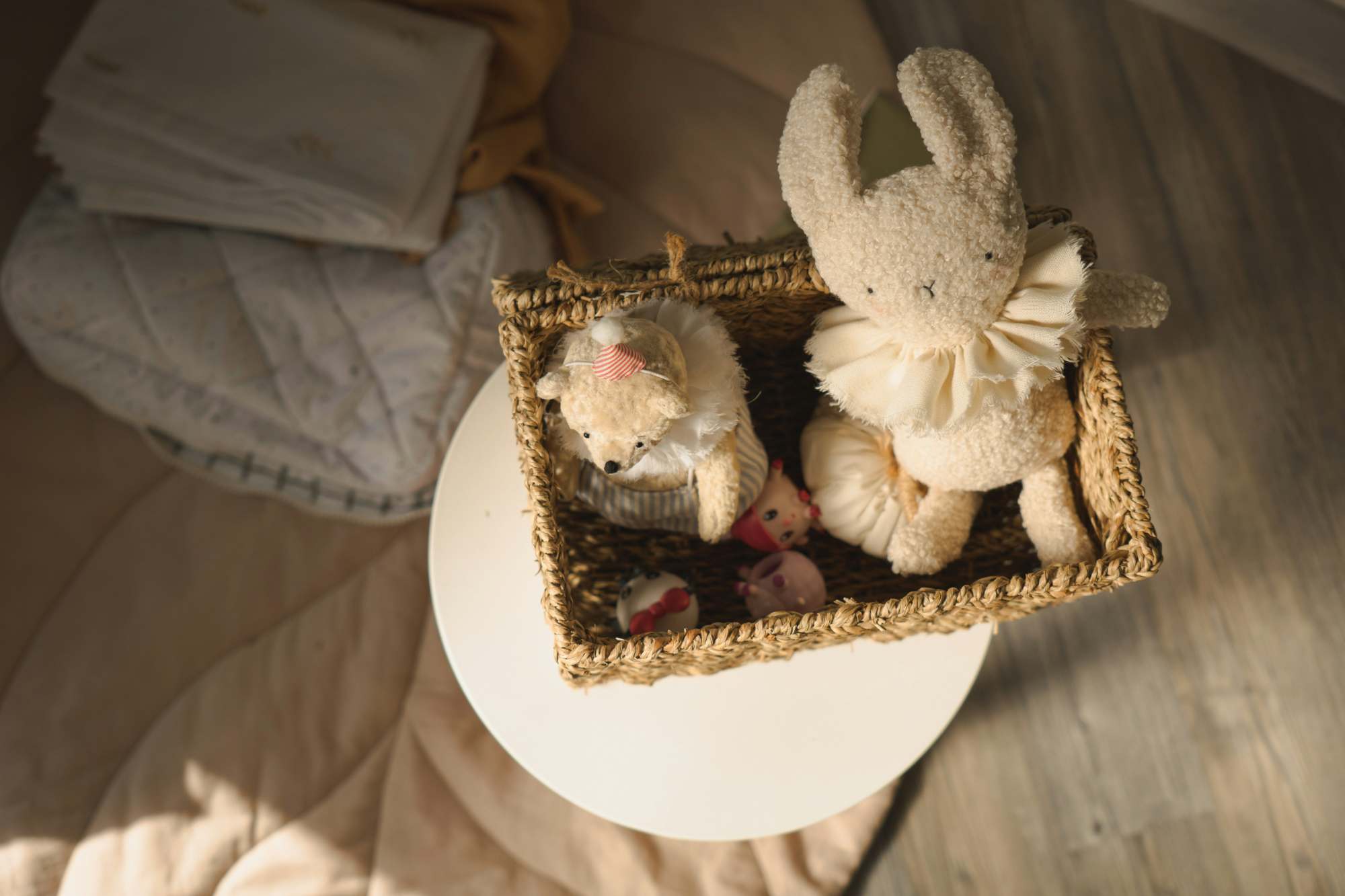 Basket of gifted plush toys sitting in a baby and toddler nursery roon