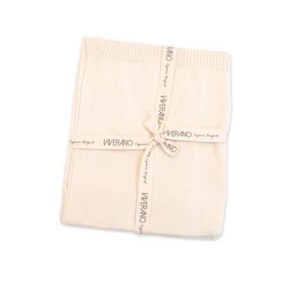 Folded beige blanket with 'Viverano' branding on a white background