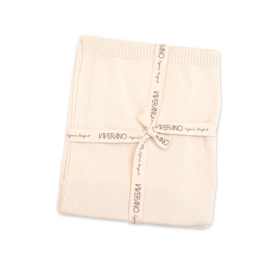 Folded beige blanket with 'Viverano' branding on a white background