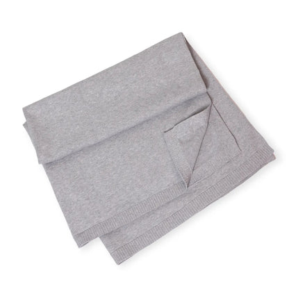 Folded gray baby swaddle blanket on a white background