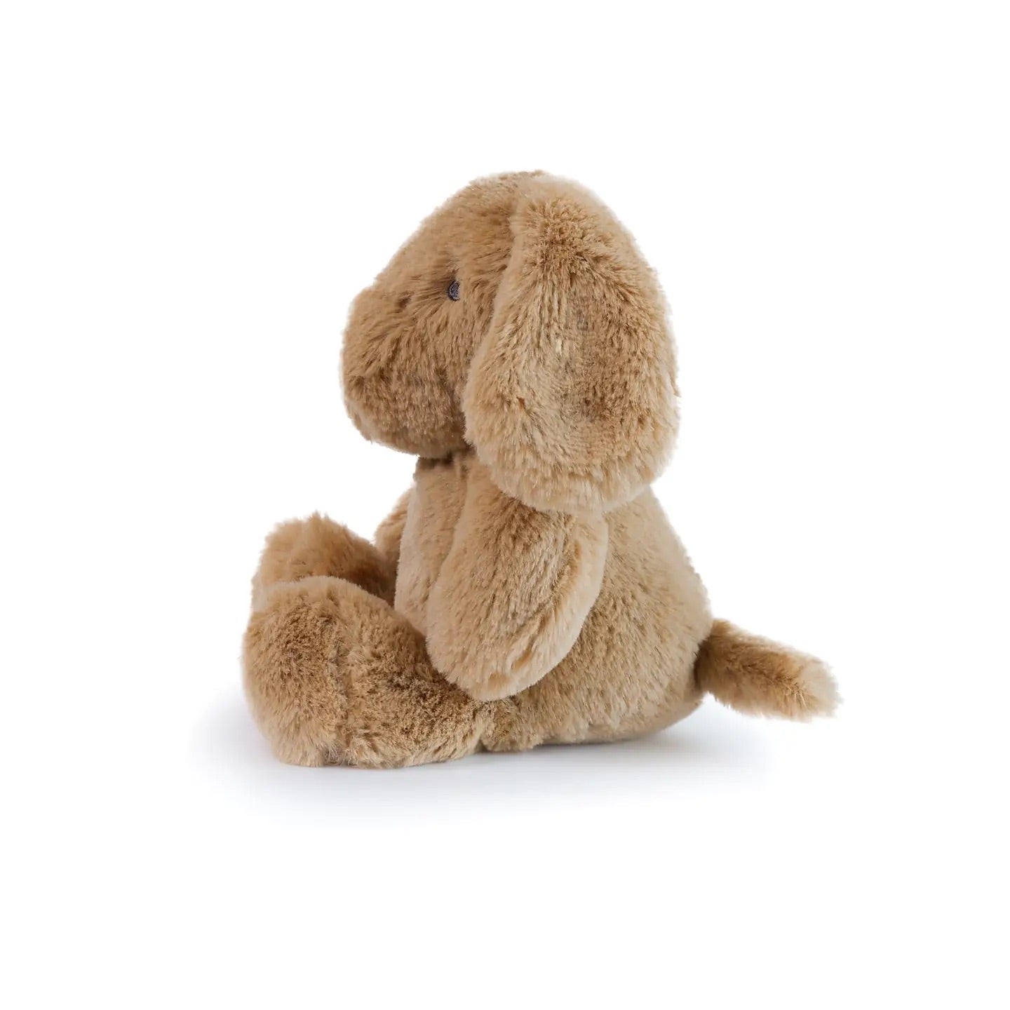 Brown dog plush toy on a white background, side profile view