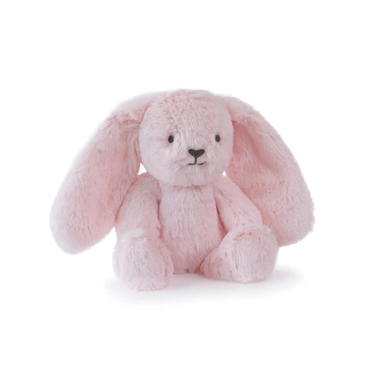 Pink plush bunny toy on a white background, sitting down