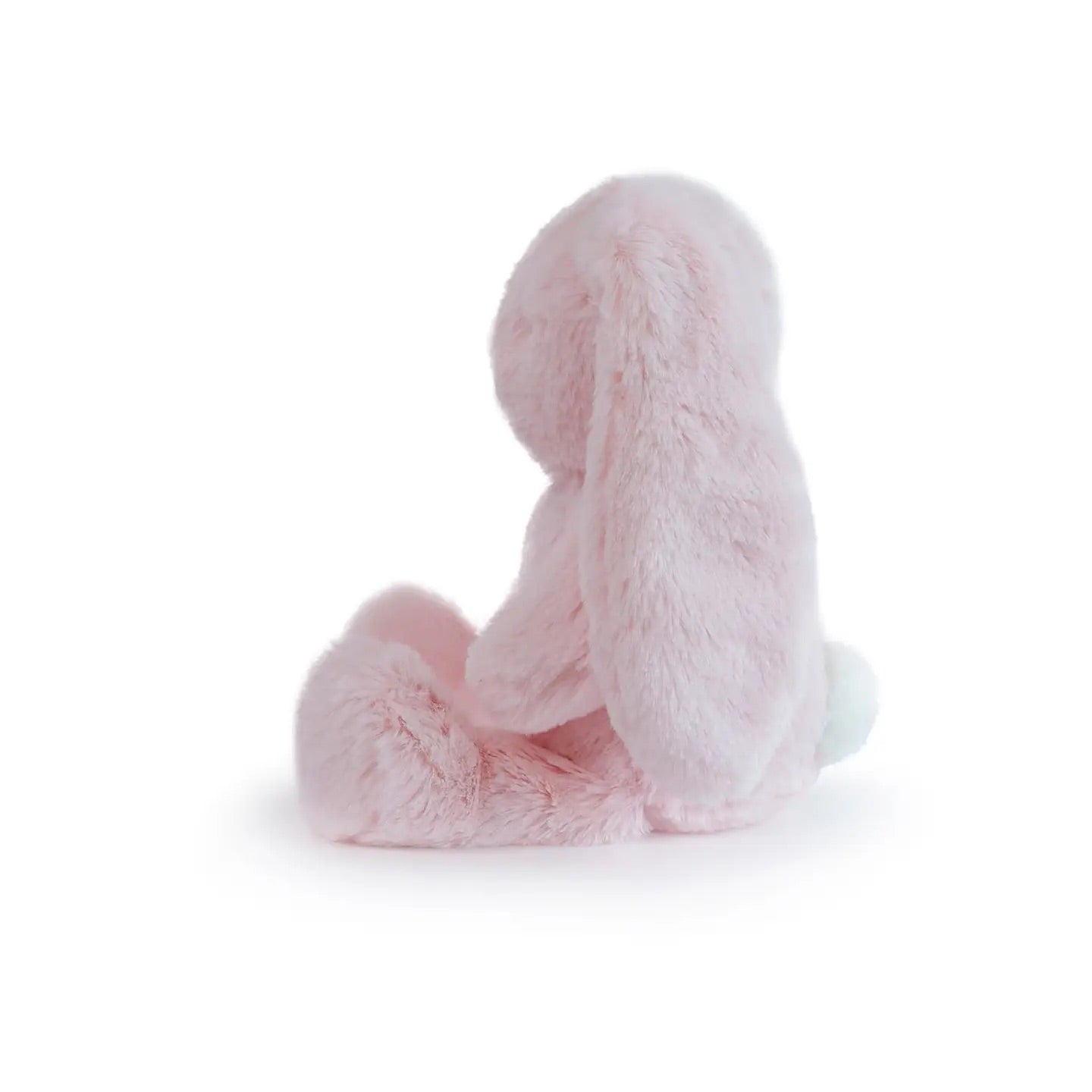 Pink plush bunny toy on a white background, side profile