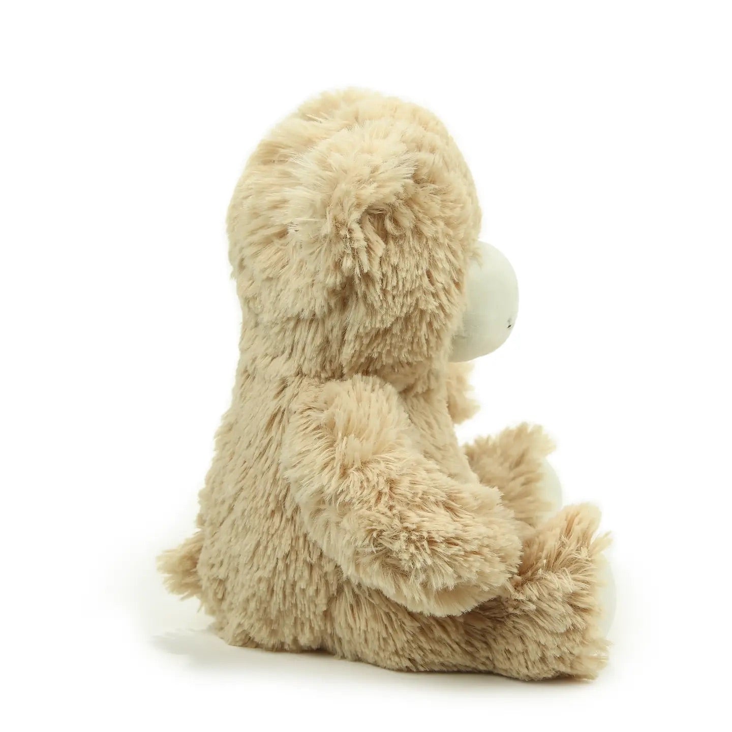 Beige teddy bear plush on a white background, side view