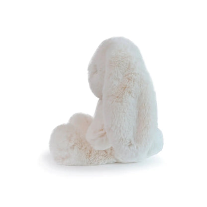 Oatmeal white plush bunny toy on a white background, side profile view